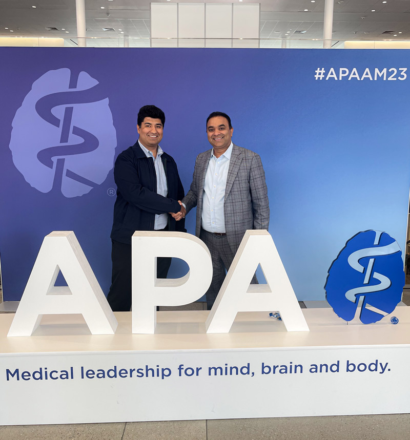 Dr. Vishal Adma, CEO and President of Integrated Psychiatric Consultants, and Rahul Sharma, CEO of Reviving Mind, shaking hands at APAAM23 in San Francisco, May 2023.